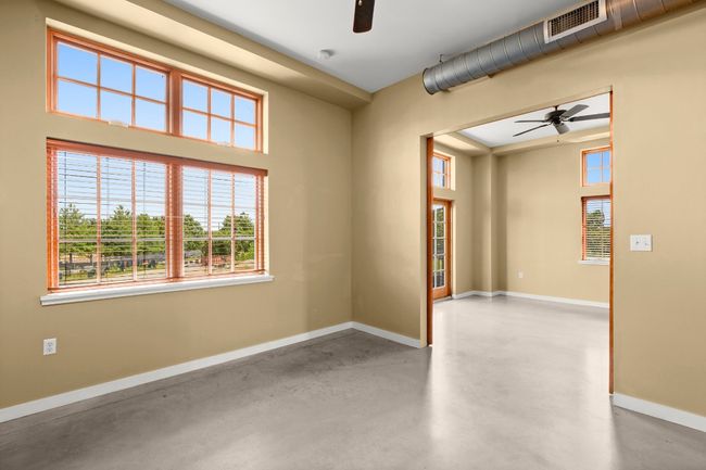 Bedroom looking out to living room | Image 8