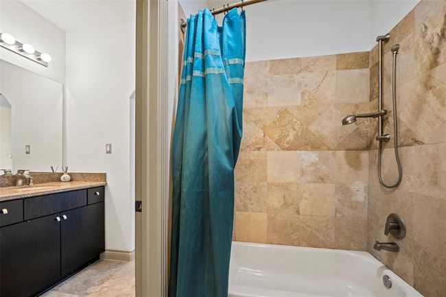 through a Jack & Jill bathroom with two separate vanity areas and linnen closets | Image 44