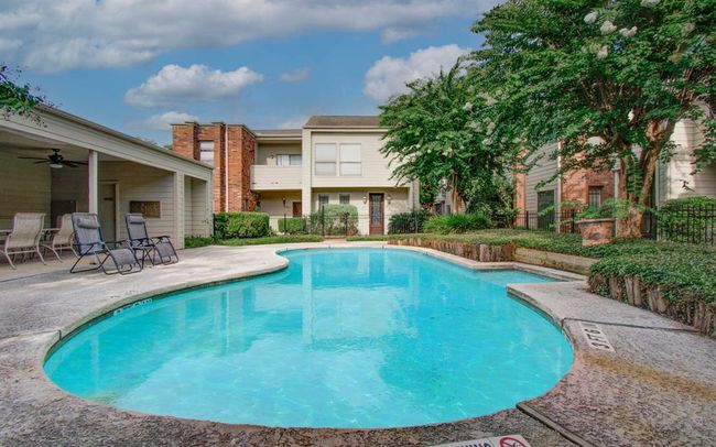 Relax and unwind in the inviting community pool, perfect for leisure and social gatherings. | Image 22