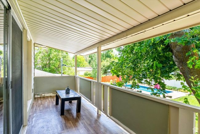 Balcony with view of pool area | Image 42