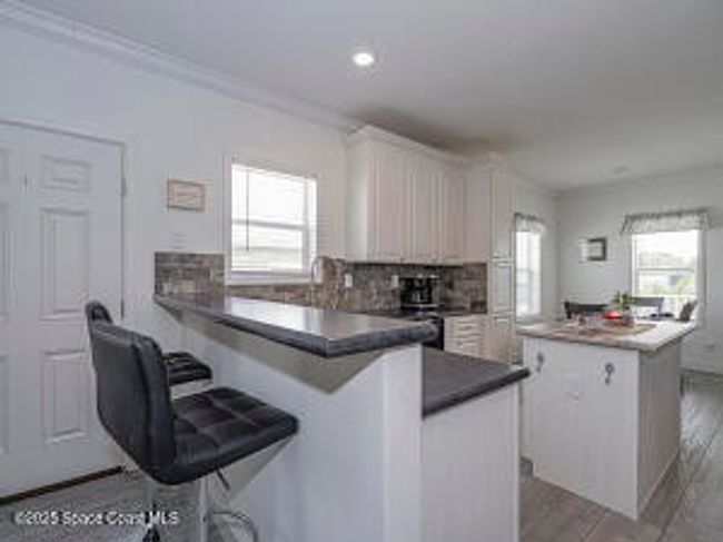623 Hyacinth Cir, House other with 3 bedrooms, 2 bathrooms and null parking in Barefoot Bay FL | Image 11
