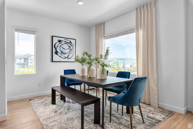 Dining area featuring light wood-style flooring | Image 9