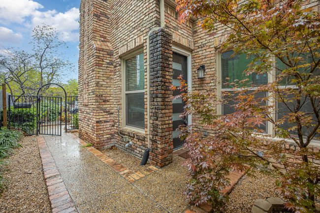 View of side of home with a gate | Image 19