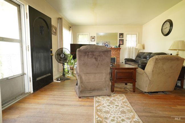 Living room featuring wood finished floors | Image 12