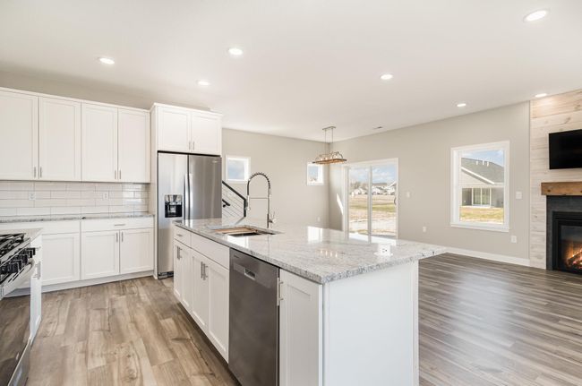 Center Island with Pop Up Electrical and Wireless Phone Charger, Stainless Steel Undermount Sink with Slider Cutting Board. | Image 4