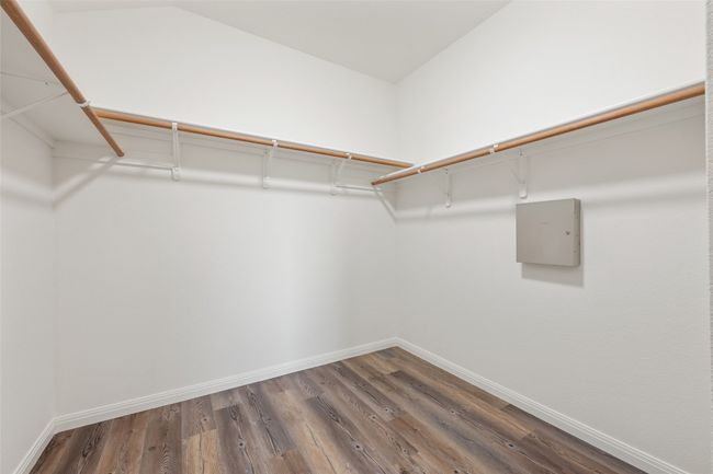 Walk in closet featuring wood finished floors | Image 29