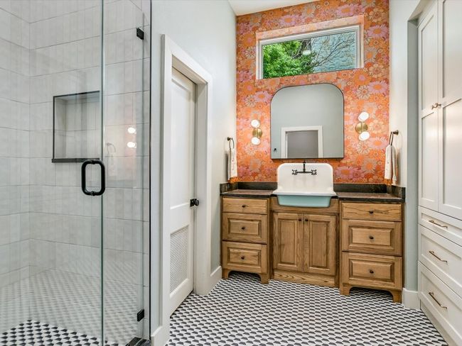 Full bath featuring a shower stall, vanity, and wallpapered walls | Image 15