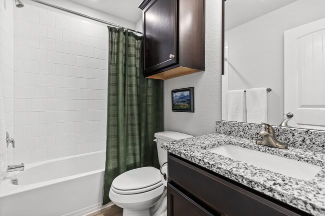 Full bathroom featuring vanity and shower / bath combination with curtain | Image 29
