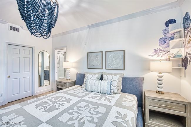 Bedroom featuring ornamental molding and wood finished floors | Image 27