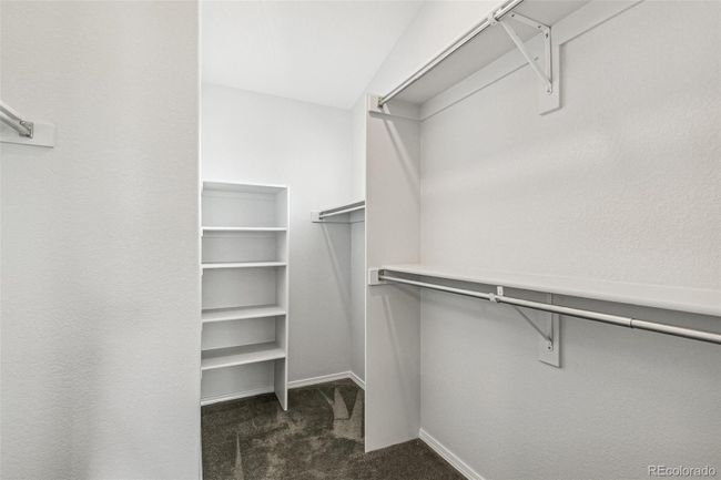 Walk-in closet in primary bedroom | Image 19
