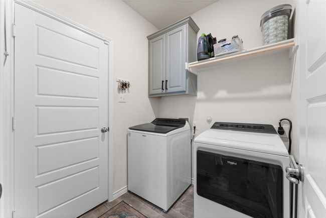 Washroom with separate washer and dryer and cabinet space | Image 28