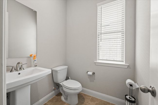 Bathroom with toilet and tile patterned flooring | Image 12