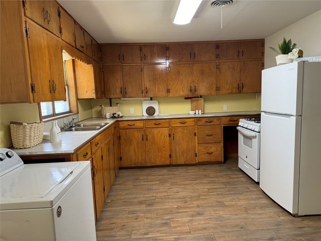 Nice size kitchen with lots of cabinet and counter space. | Image 9