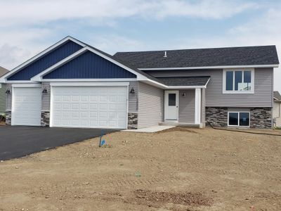 Welcome to the Normandy Plus split entry home that offers 2 Bedrooms, 1 bath with 1055 square feet on the main level plus a full walkout basement and a 3 car garage. | Image 1