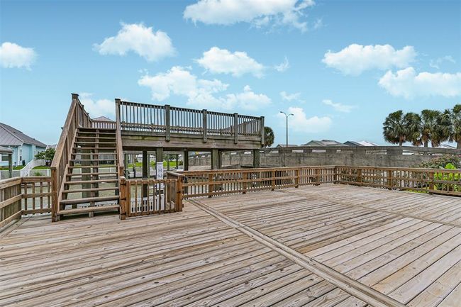 Large party deck that leads to deck above the boathouse | Image 8