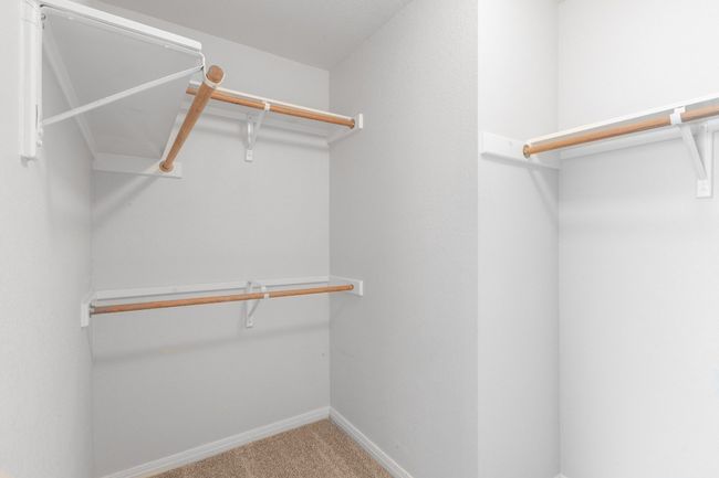 Spacious closet featuring carpet floors | Image 30