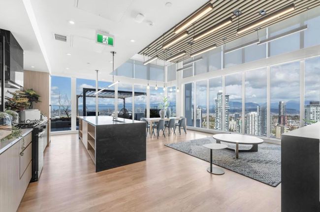 Living room with a view of city, visible vents, a wealth of natural light, and light wood-style flooring | Image 17