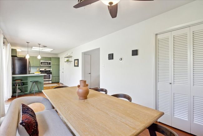 Dining space featuring light wood-style flooring and ceiling fan | Image 13