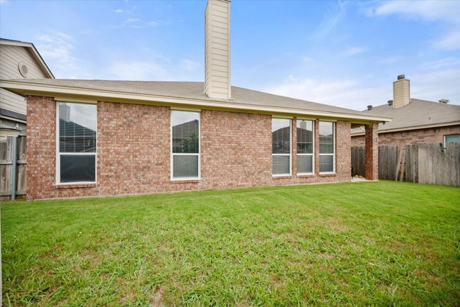 Back of house with a chimney and brick siding | Image 22