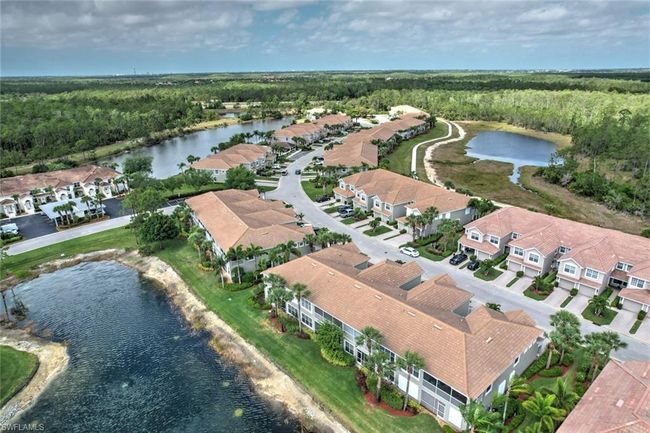 Birds eye view of property featuring a water view, a wooded view, and a residential view | Image 36