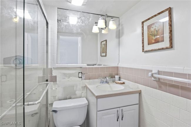 A bright bathroom with a large walk-in shower that combines practicality and elegance for your daily routine. | Image 24
