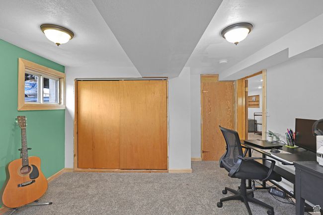 Carpeted home office with baseboards | Image 24