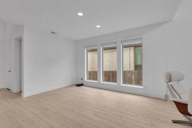 Unfurnished room with light wood-type flooring and recessed lighting | Image 17