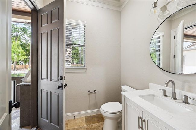 Half Bath Doubles as Guest/Pool Bath. Easy Access To Outdoor Patio/Kitchen | Image 25
