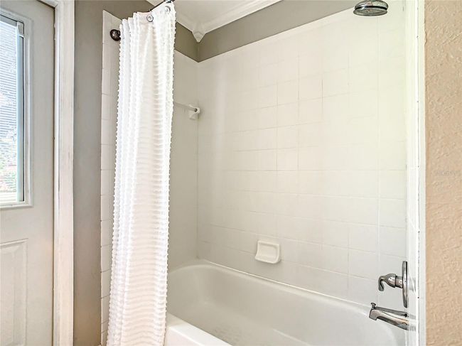 Shower in tub in guest bathroom | Image 65