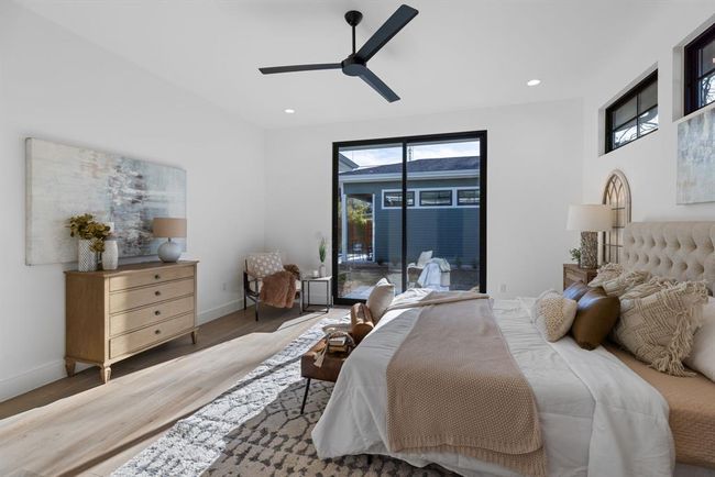 Bedroom with access to outside, wood finished floors, baseboards, a ceiling fan, and recessed lighting | Image 9