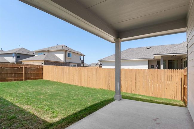 View of yard with a patio and fence | Image 29