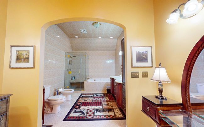 Full bathroom with toilet, a bidet, vanity, a bath, and recessed lighting | Image 44