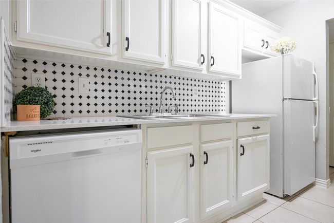 Kitchen featuring new granite counters, new dishwasher and refrigerator | Image 5