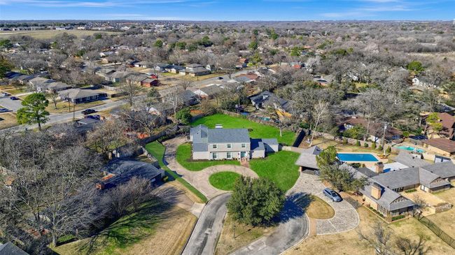 Aerial overview of property's location featuring nearby suburban area and a pool area | Image 36