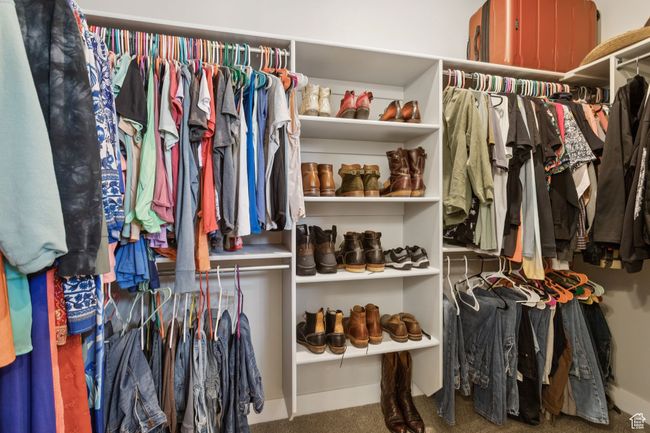 Walk in closet featuring carpet | Image 27