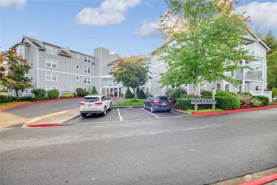 1 underground parking space and plenty of guest parking in front of and in back of building. | Image 2