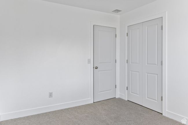 Unfurnished bedroom featuring a closet and carpet floors | Image 24