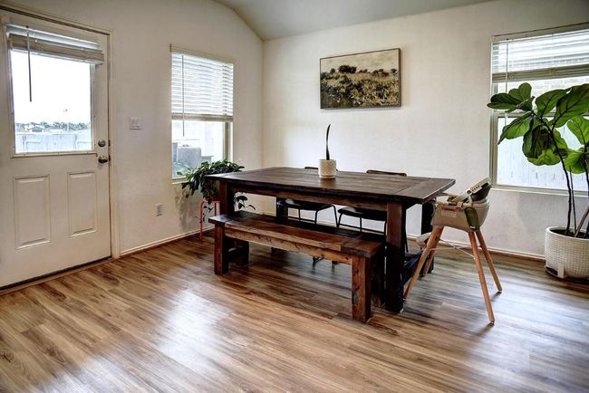 Dining space featuring light wood finished floors and plenty of natural light | Image 14