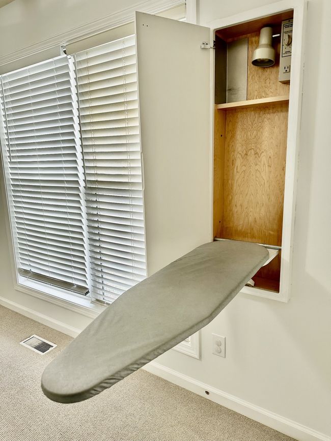 Ironing board at the ready in hidden wall cabinet in 2nd bedroom. | Image 26