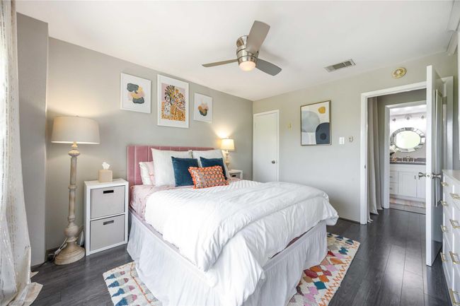 The dark floors contrast nicely with the light walls. | Image 16