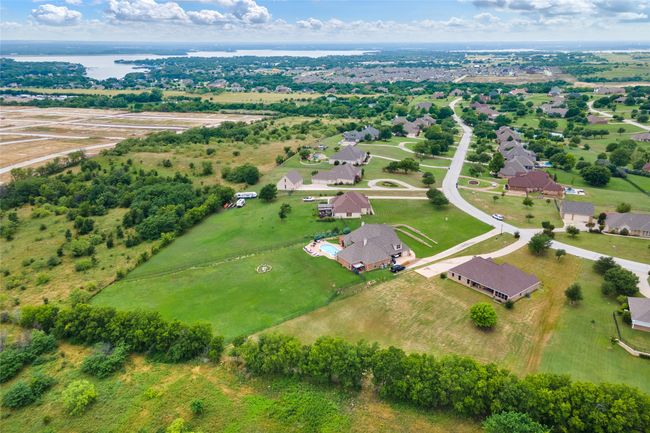 Aerial view of residential area featuring a nearby body of water | Image 36