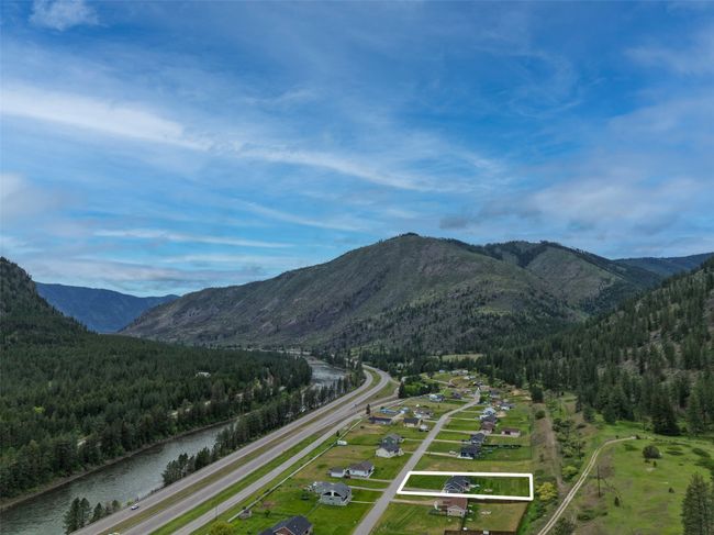 Mountain view with a heavily wooded area and a nearby body of water | Image 66
