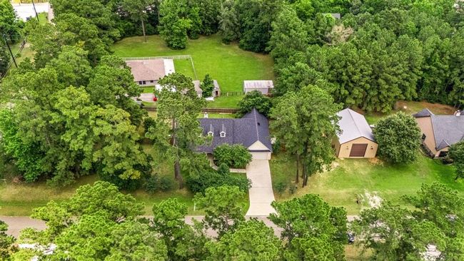 Aerial view demonstrating the possibility of adding a workshop to the property. Many neighbors have workshops next to their homes. | Image 39