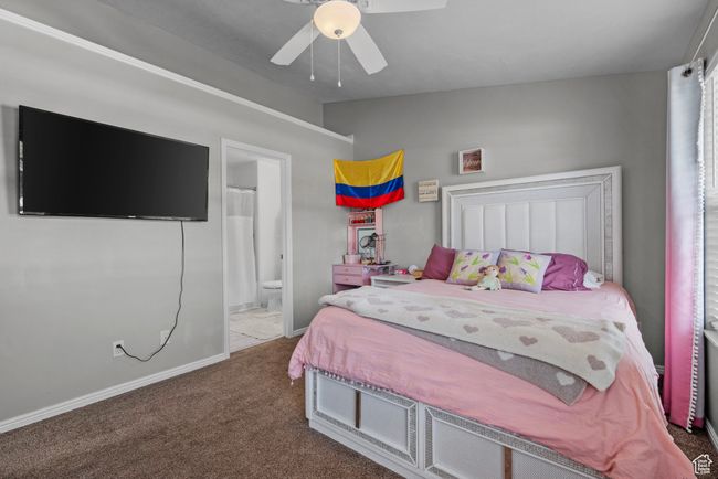 Bedroom with lofted ceiling, carpet, ensuite bathroom, and ceiling fan | Image 14