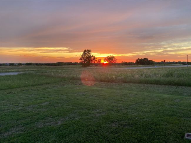 Yard at dusk featuring a rural view | Image 39