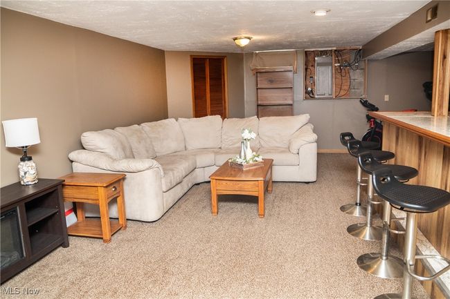 View of carpeted rec room | Image 41
