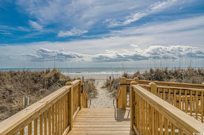 View of property's community with a beach view and a deck with water view | Image 33