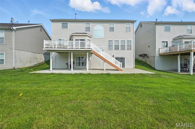Rear view of property with a patio, a wooden deck, stairway, and a yard | Image 28