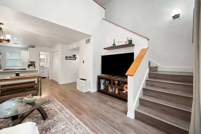 Living area featuring stairs and light wood finished floors | Image 10
