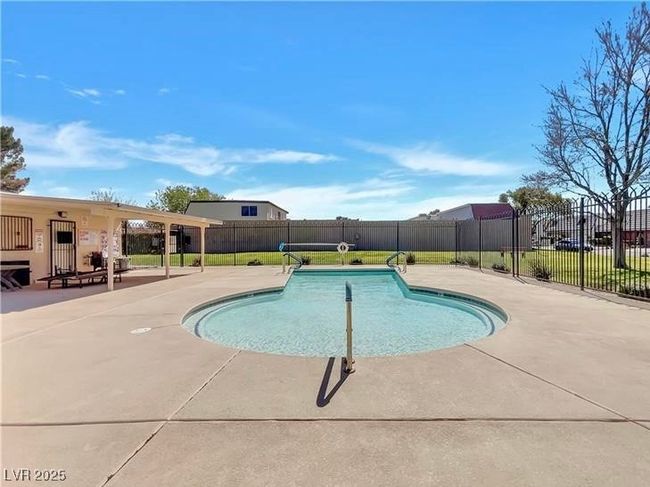 View of swimming pool with a patio area | Image 50